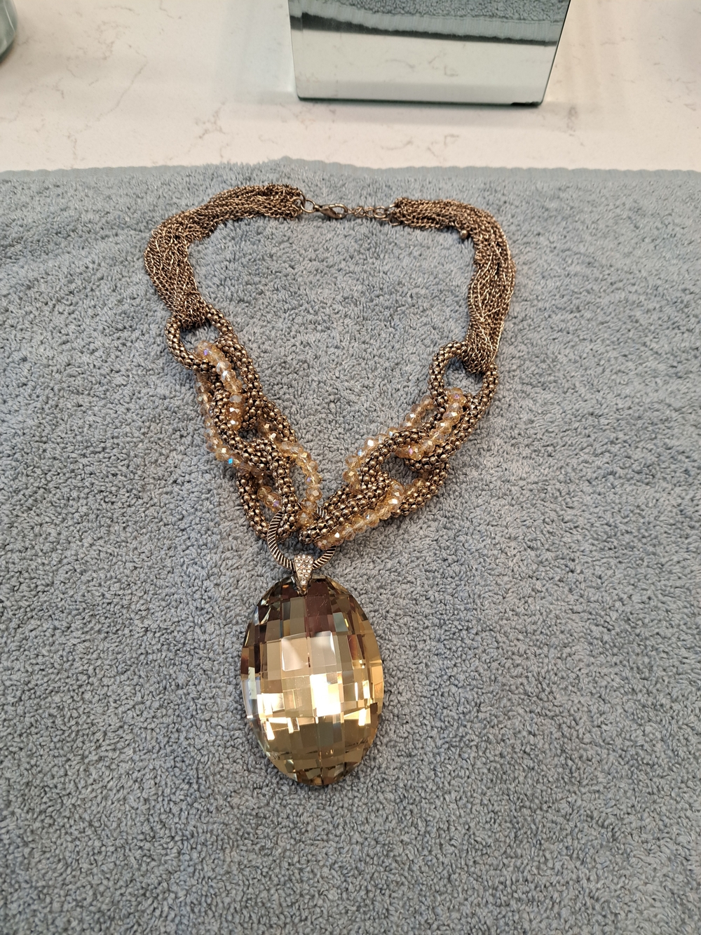 Cache Gold Multi-Chain Necklace with Faceted Oval Pendant